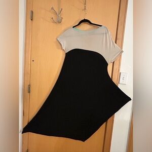 Marie St Pierre midi dress. GUC Asymmetrical sleeves , narrow at knee.